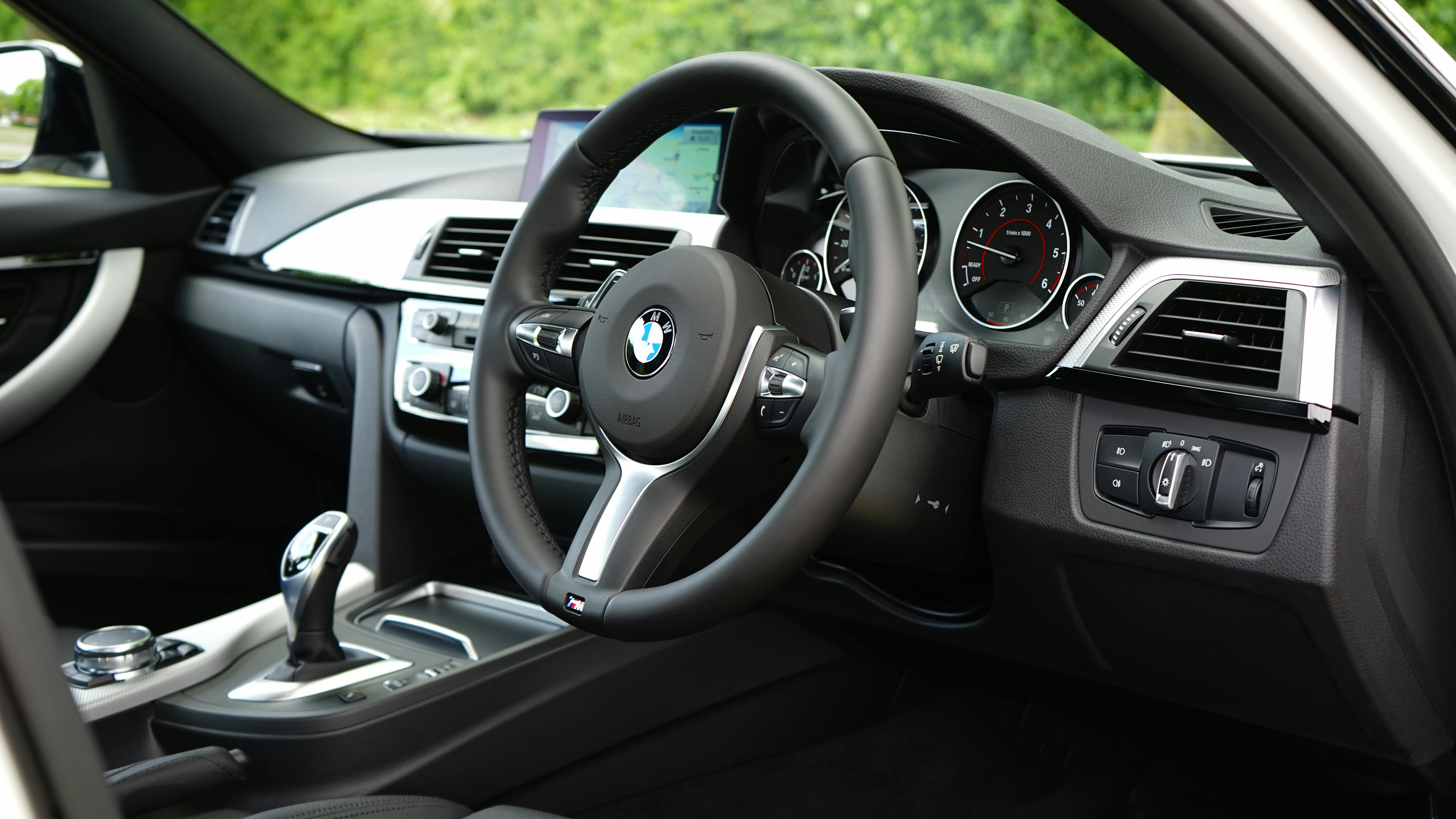 Interior of a car showing the steering wheel and dashboard