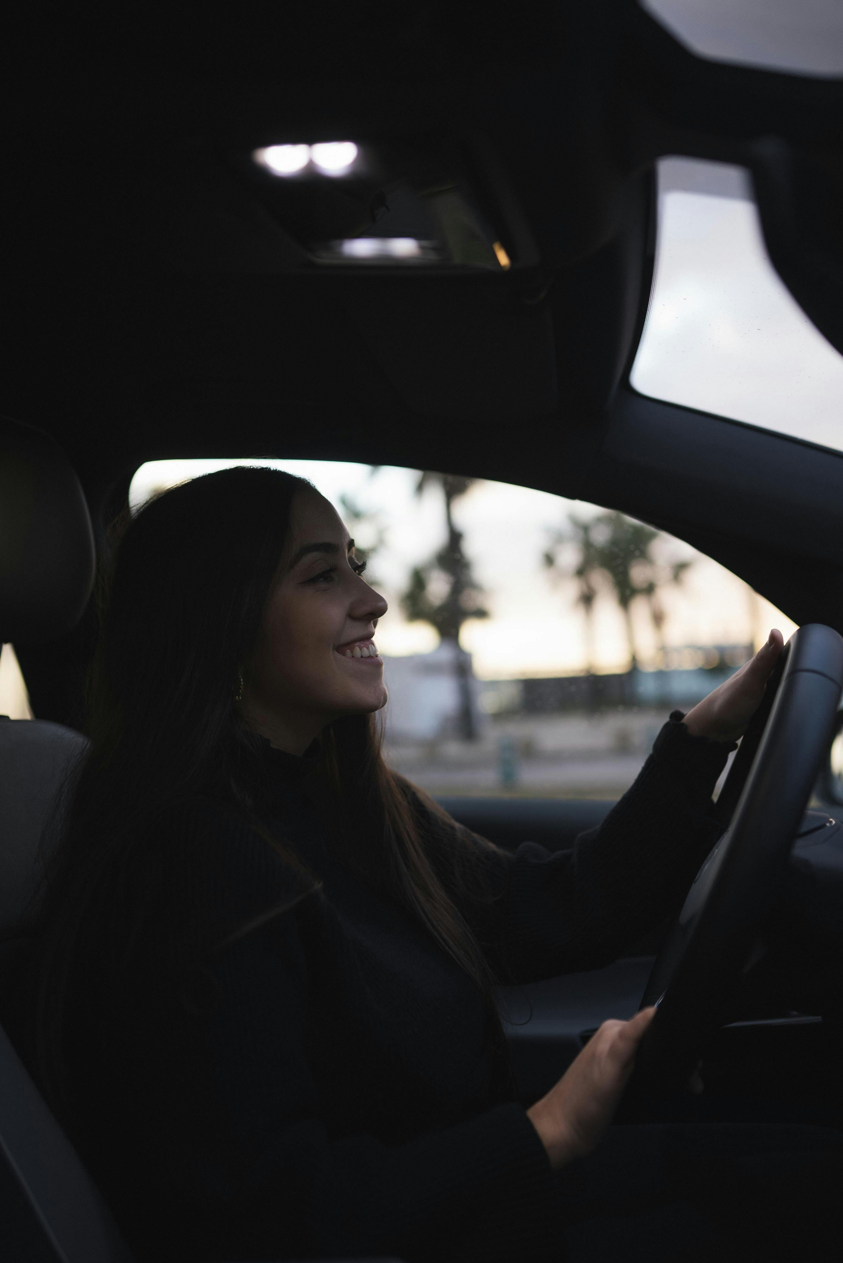 A driver behind the wheel on a work journey