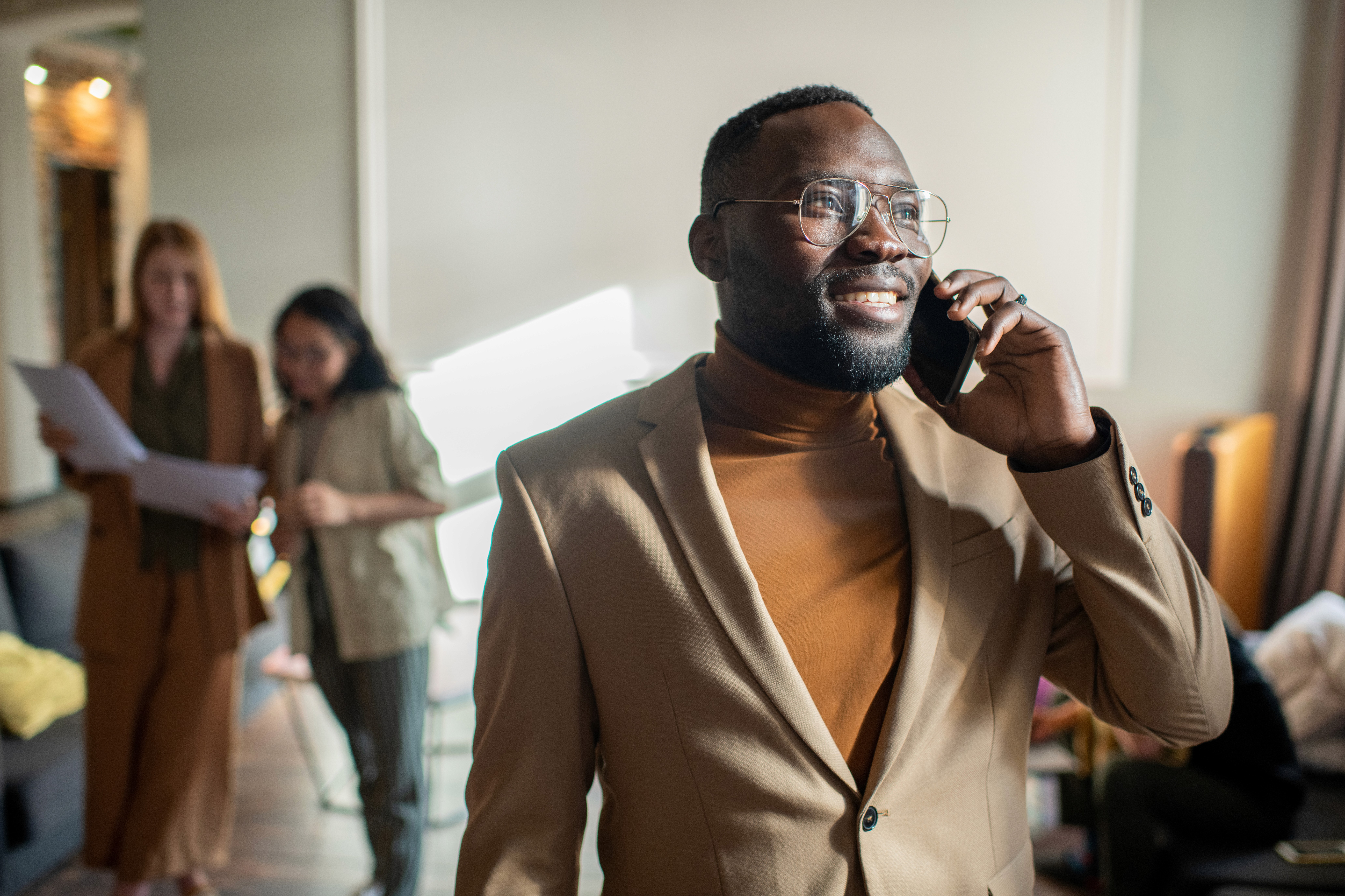 A man taking a phone call in an office