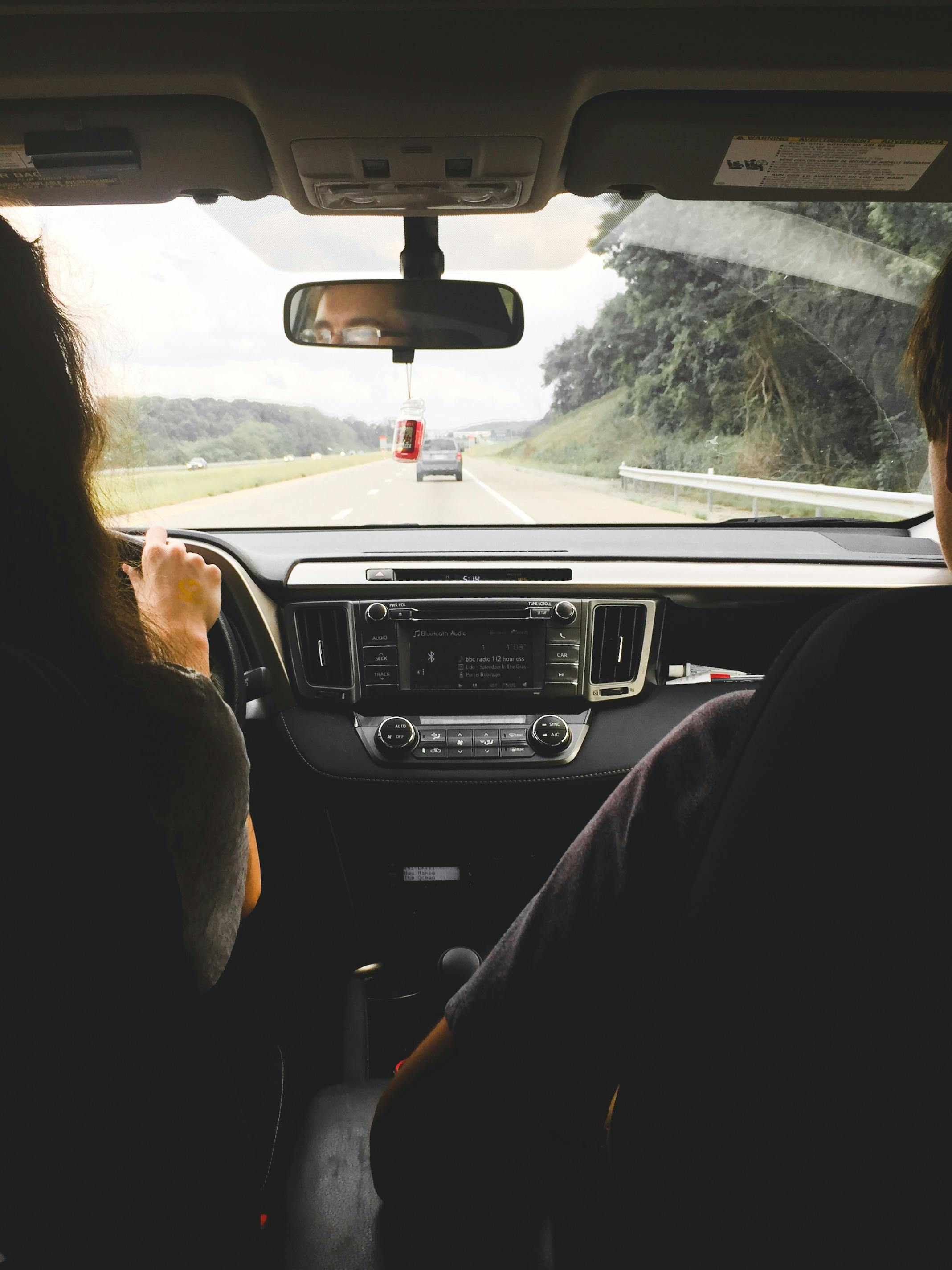 The view through a car windscreen on an open road